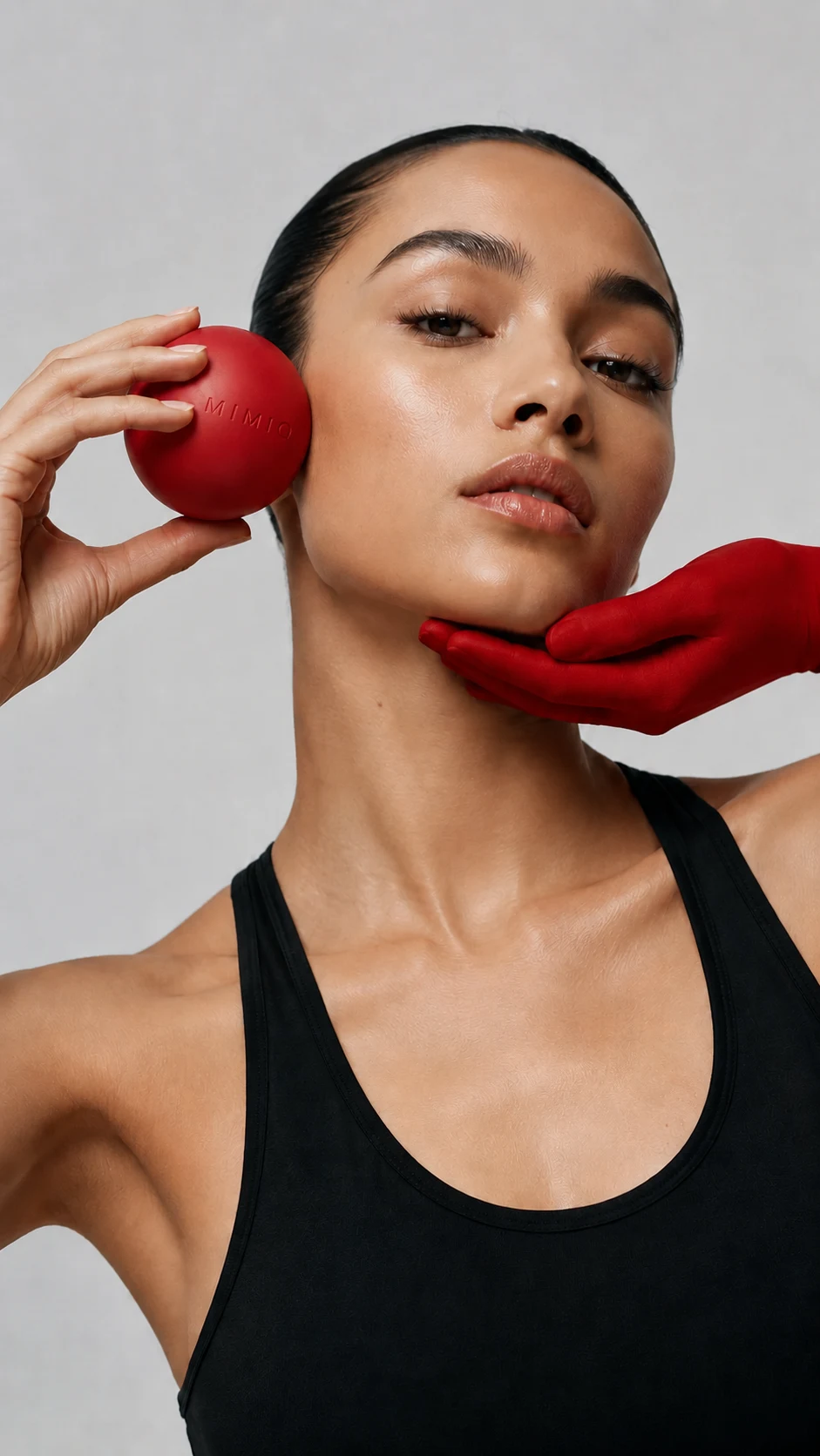 MIMIQ facial sculpting model with the signature red massage tool