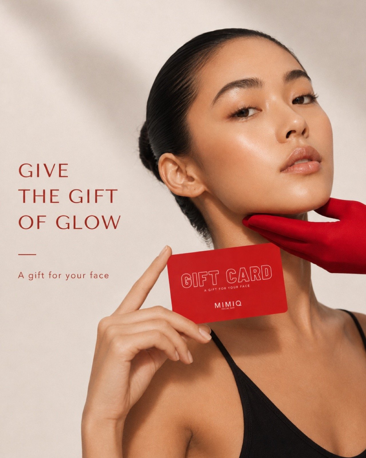 MIMIQ model holding a red digital gift card