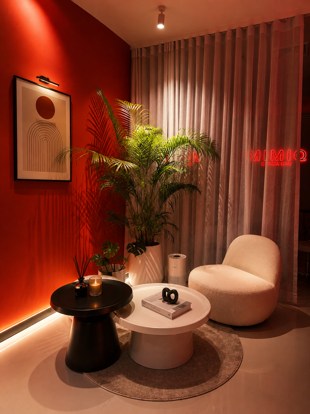 MIMIQ lounge with red feature wall and greenery