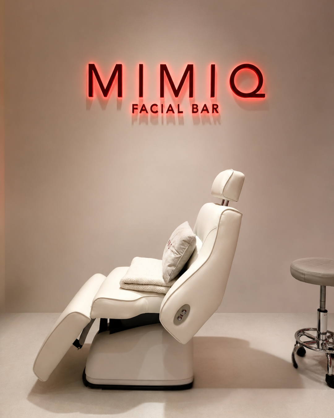 MIMIQ treatment chair beneath the Facial Bar sign
